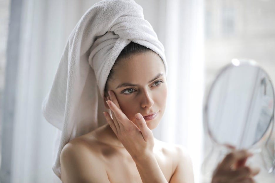 Credit: Pexels | Andrea Piacquadio - Woman After Shower Examining Skin With Mirror