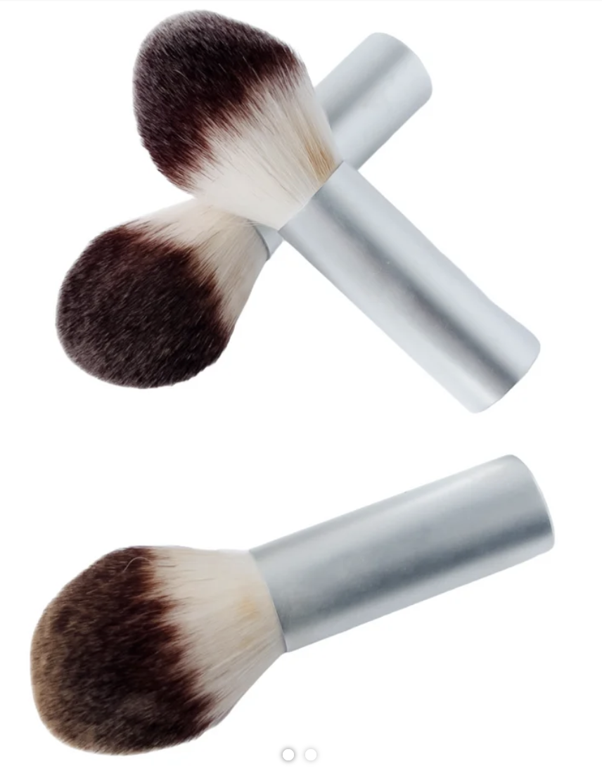 La Bella Donna Perfecting Foundation Brush with loose mineral foundation lightly worked into the bristles.