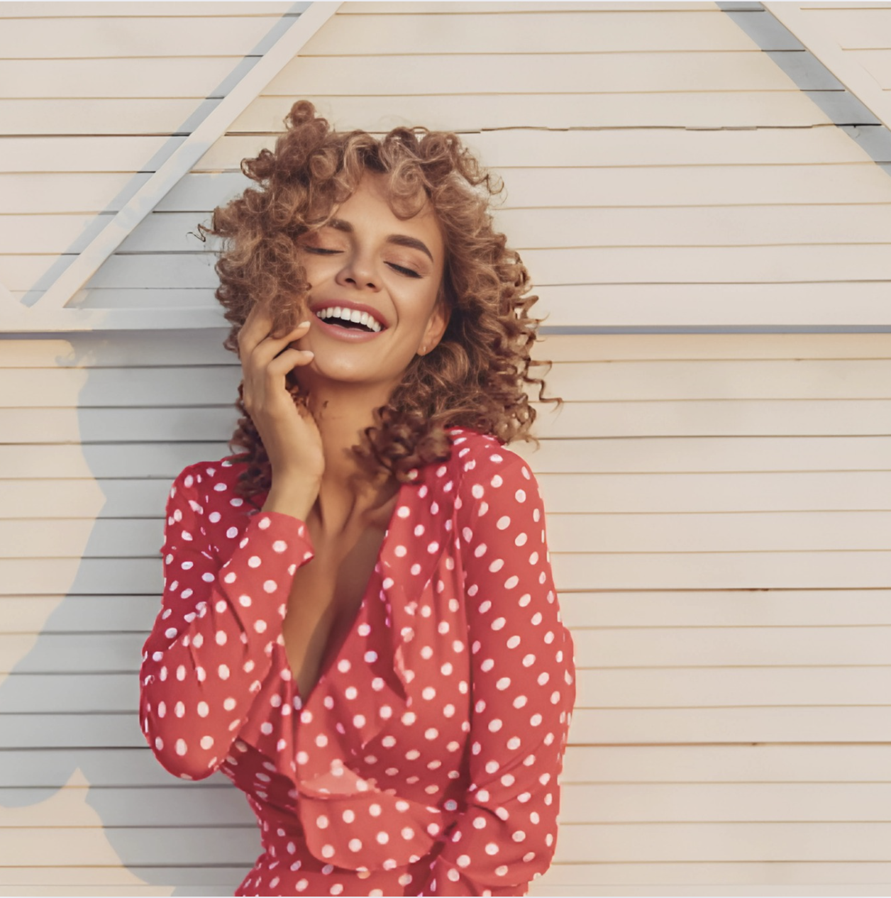 Image of woman in a red dress with white polka dots