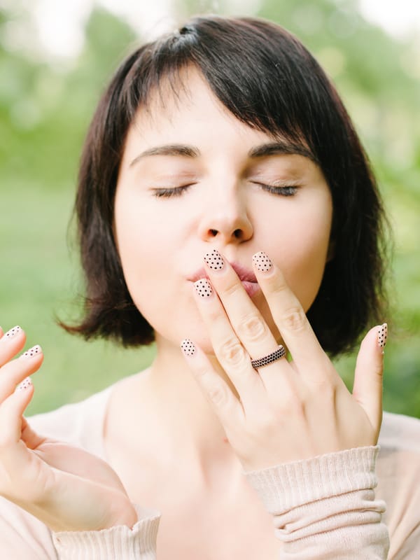 Woman Kissing Hand in a Gesture of Goodbye